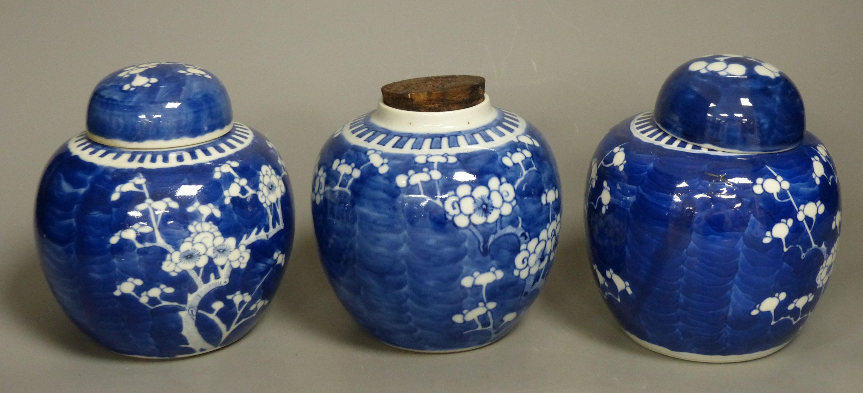 Three Chinese blue and white prunus jars, late 19th century/early 20th century
